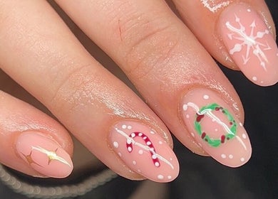 Festive nail art at Empire Beauty, Liverpool, England, GB featuring Christmas-themed designs.