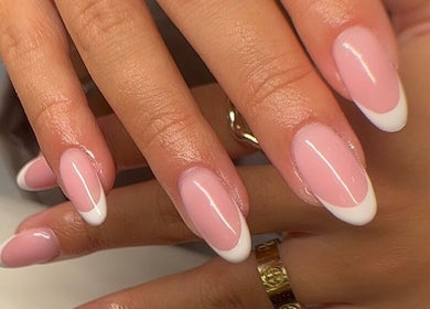 Elegant French manicure at Empire Beauty, Liverpool, England, GB showcasing perfect nail care.
