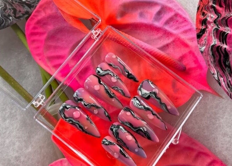 Elegant nail art display at Miss Betty Rose, Forest Lodge, New South Wales, AU. Set against vivid pink and purple flowers.