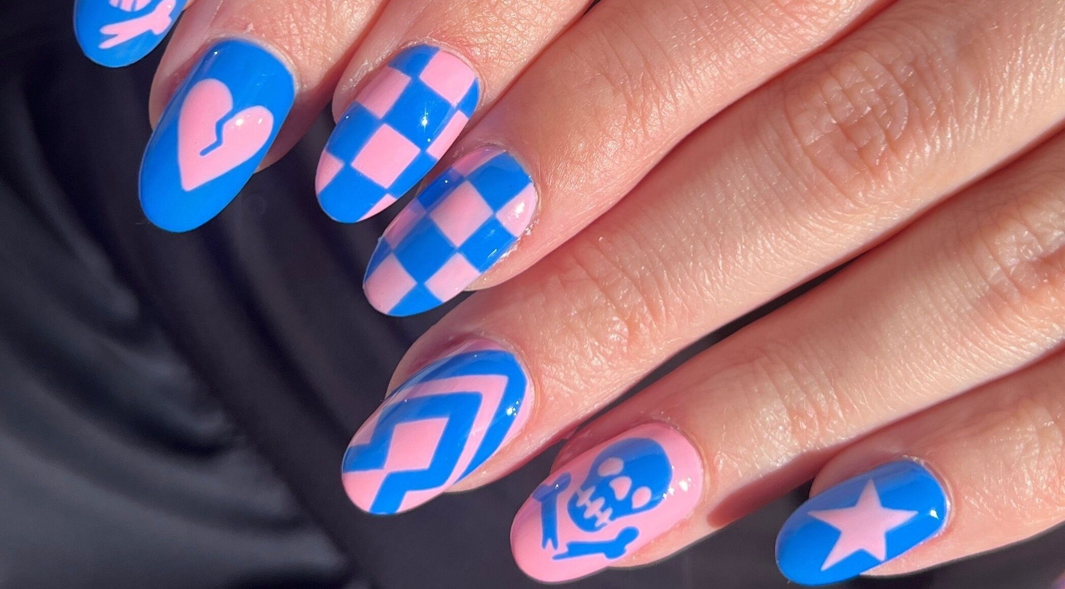 Colorful nail art at Miss Betty Rose, Forest Lodge, New South Wales, AU, showcasing blue and pink designs.