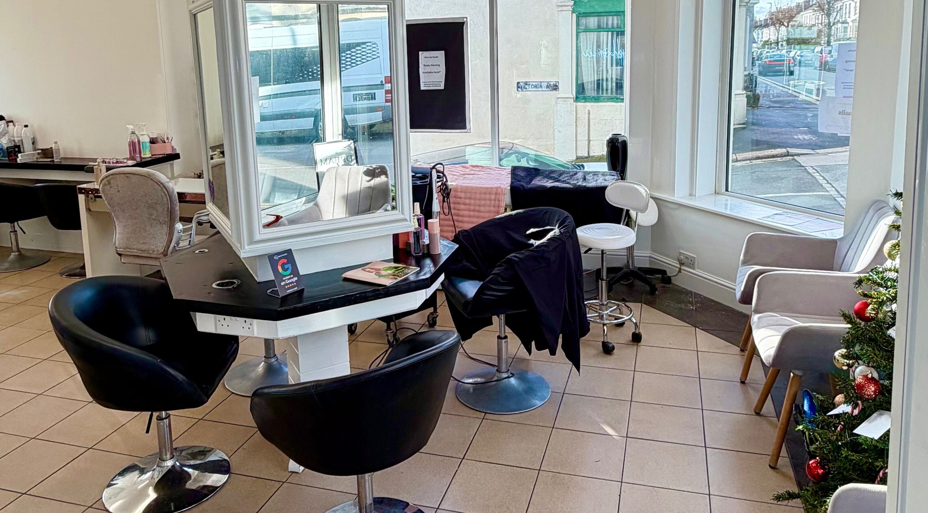 Interior of Hair & Makeup by Galyna Shchyrba in Plymouth, England, featuring chic styling stations.