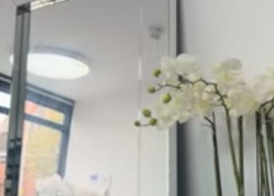 Bright, serene room with mirror and orchids at Annayah Aesthetics (Kemptown), Brighton And Hove, England, GB.