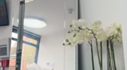 Bright, serene room with mirror and orchids at Annayah Aesthetics (Kemptown), Brighton And Hove, England, GB.