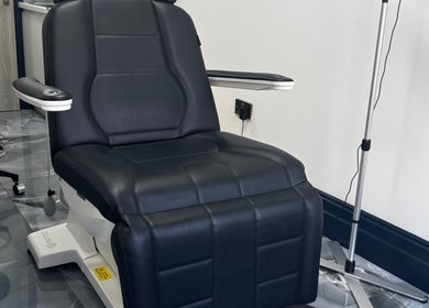 Modern black treatment chair at Annayah Aesthetics (Kemptown), Brighton And Hove, England, GB.