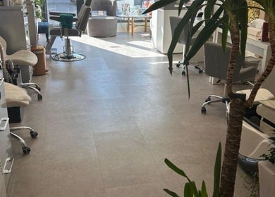 Inside Annayah Aesthetics (Hove), a modern, sunlit salon in Brighton And Hove, England, GB with stylish chairs.