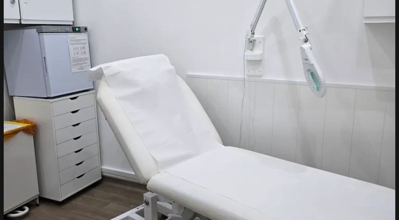 Treatment room at Annayah Aesthetics, Brighton And Hove, England, GB, featuring a modern white chair and equipment.