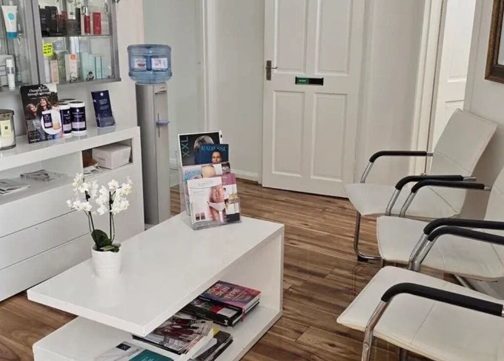 Cozy reception area at Annayah Aesthetics, Brighton And Hove, England, GB with seating and beauty products displayed.