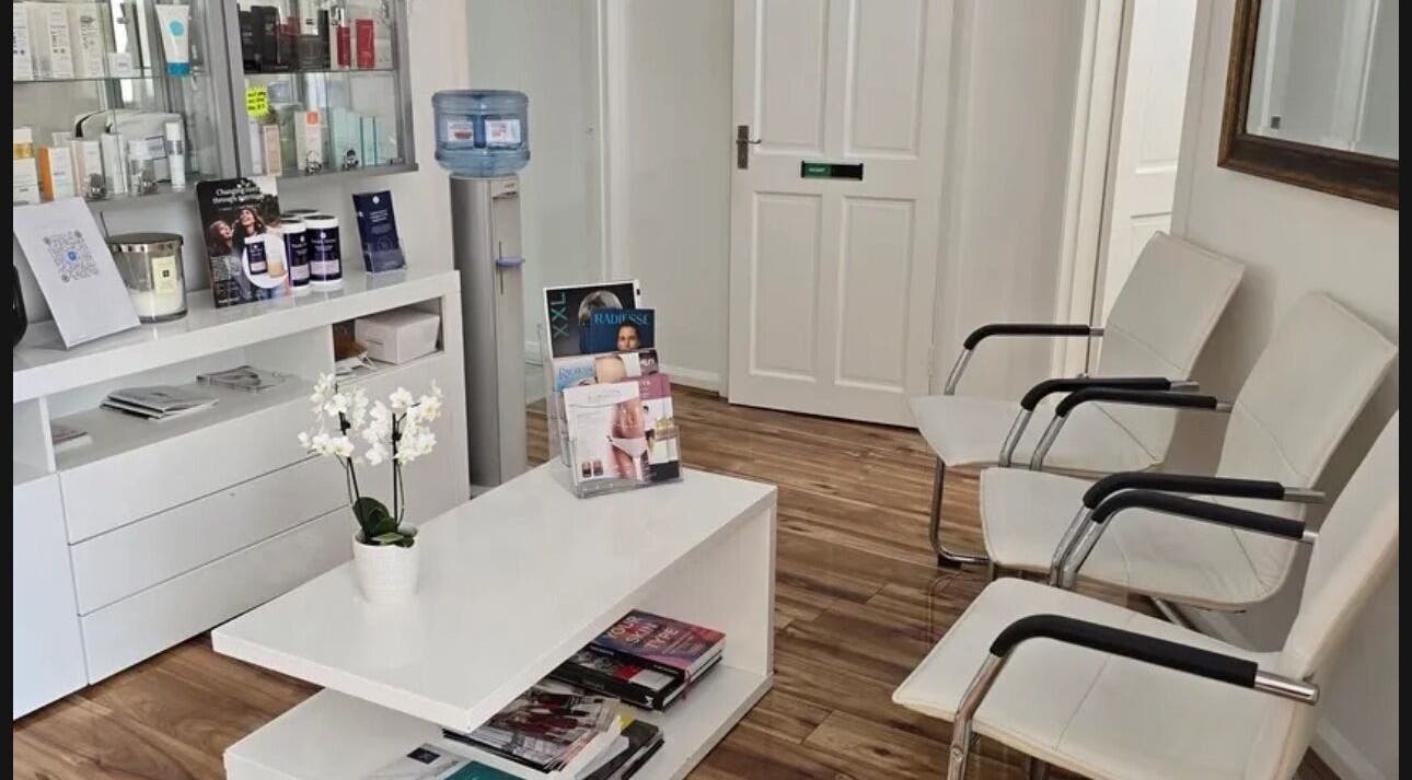 Cozy reception area at Annayah Aesthetics, Brighton And Hove, England, GB with seating and beauty products displayed.
