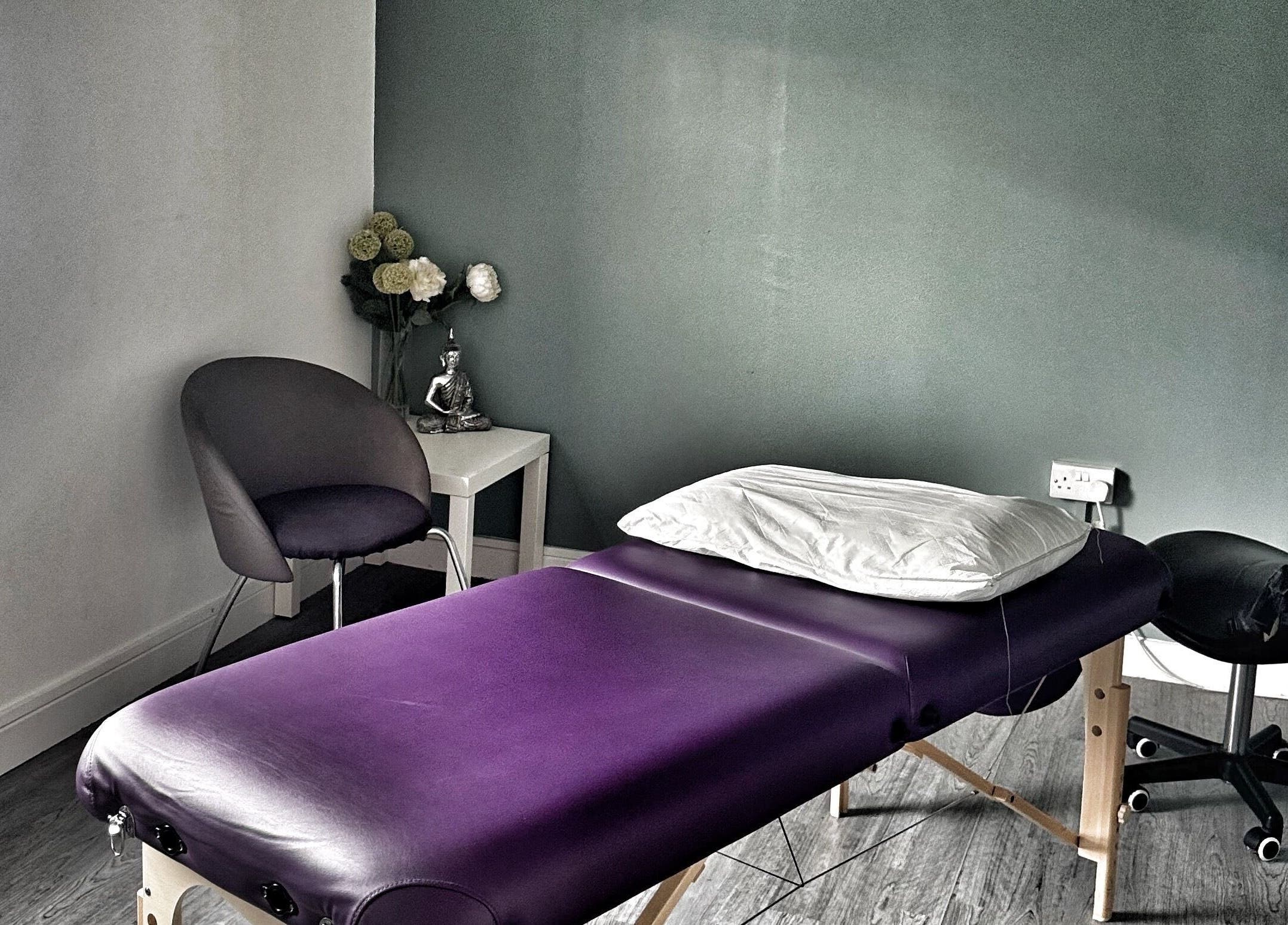 Elegant treatment room at Annayah Aesthetics, Brighton And Hove, England, GB, featuring a massage table and decor.