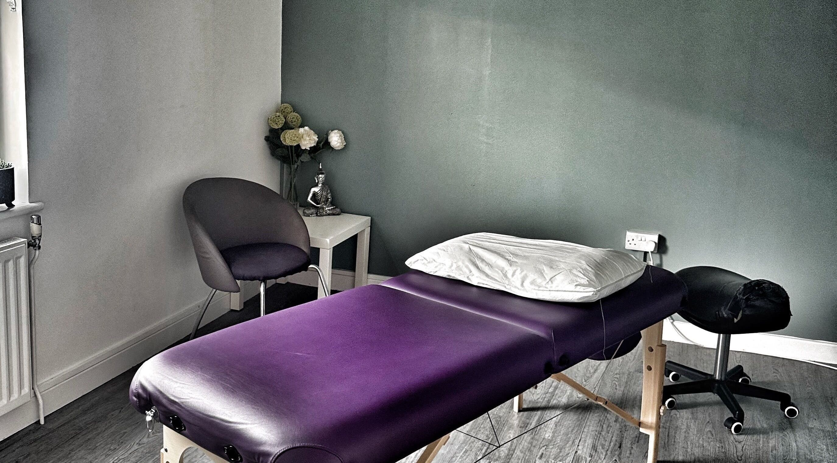 Elegant treatment room at Annayah Aesthetics, Brighton And Hove, England, GB, featuring a massage table and decor.