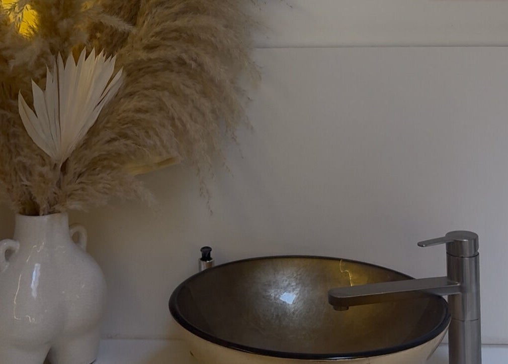 Elegant basin and decor at Refined By Maja, Inverness, Scotland, GB. Aesthetic pampas grass arrangement beside sink.
