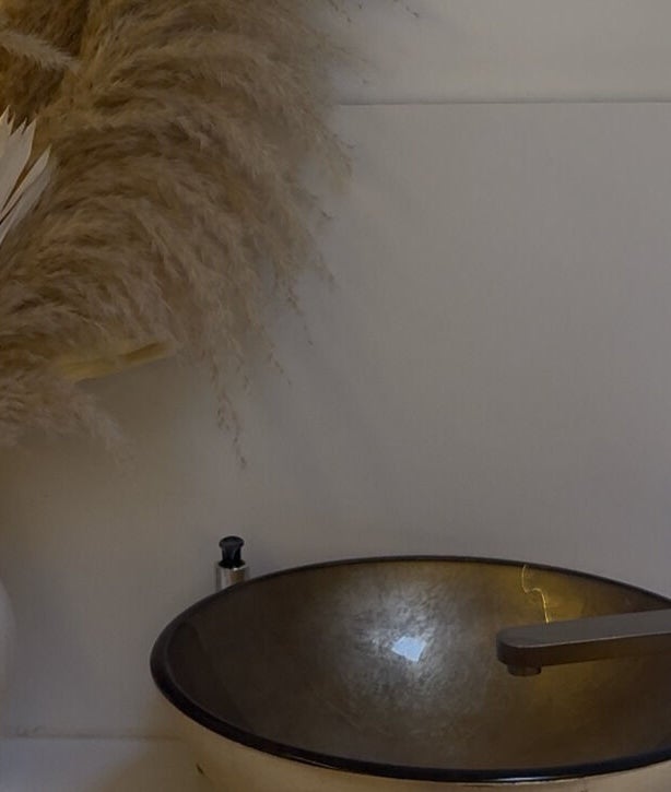 Elegant basin and decor at Refined By Maja, Inverness, Scotland, GB. Aesthetic pampas grass arrangement beside sink.