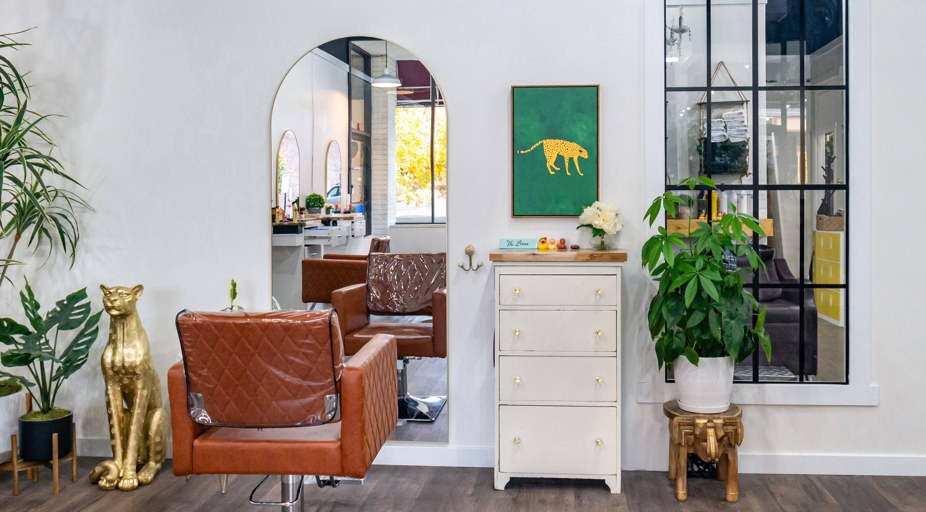 Interior of Bad And Boujee Beauty Bar, Renton, Washington, US, featuring a stylish chair and chic decor.