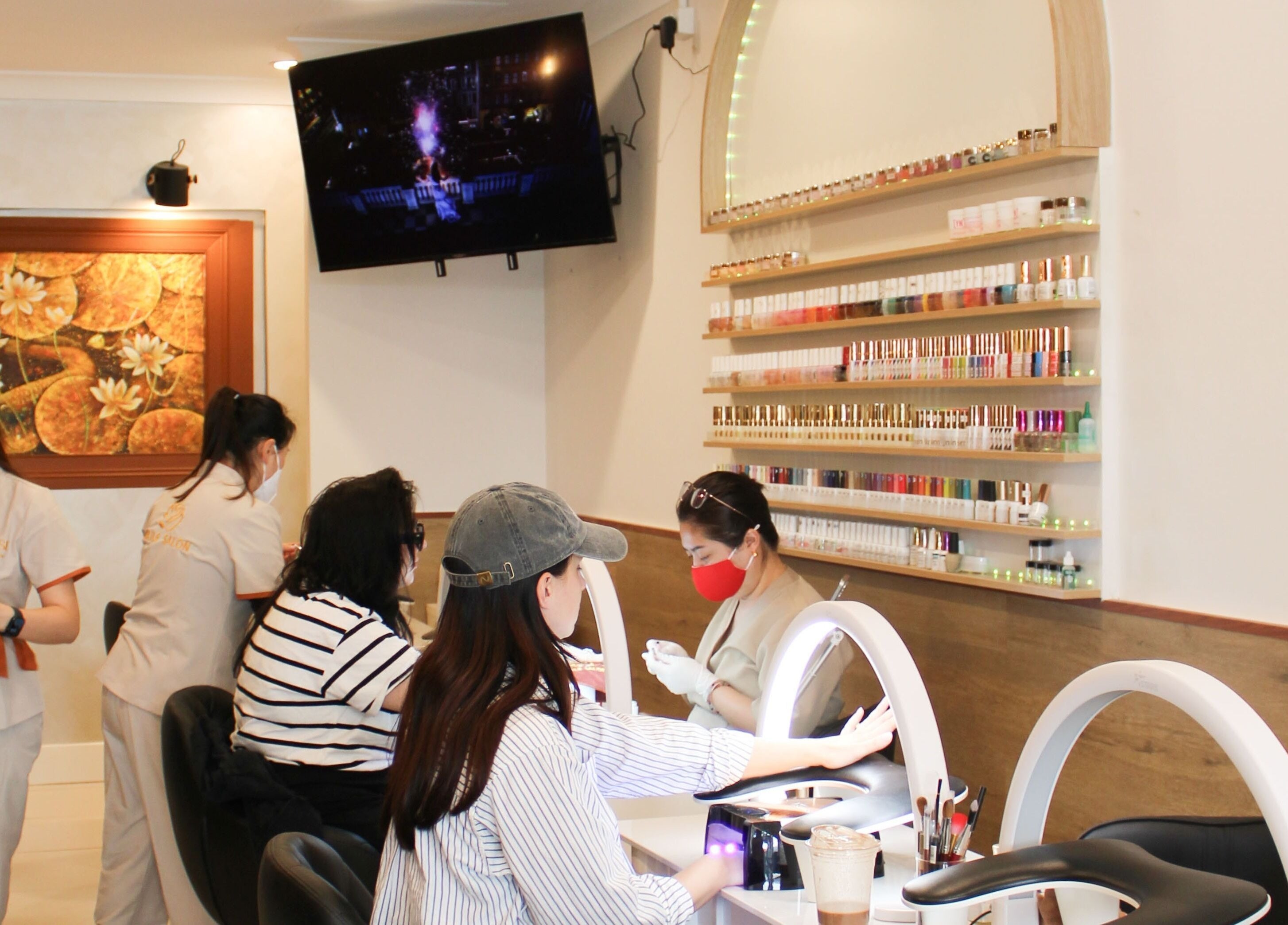 Interior of Larose Nails Enmore showing professionals at work in Enmore, New South Wales, AU.