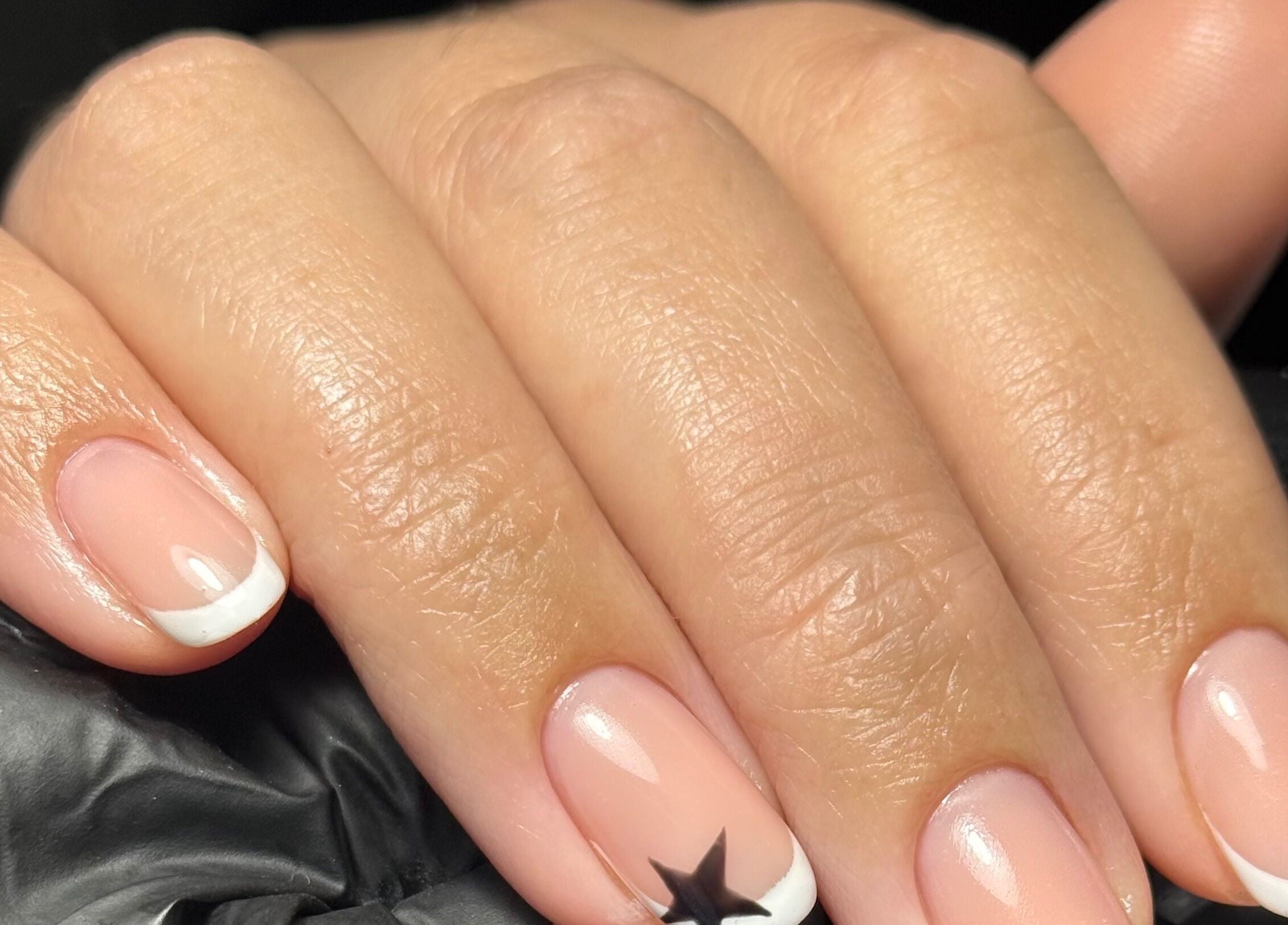 French manicure with a star design at Beauty Nook by Madie, Brabham, Western Australia, AU.