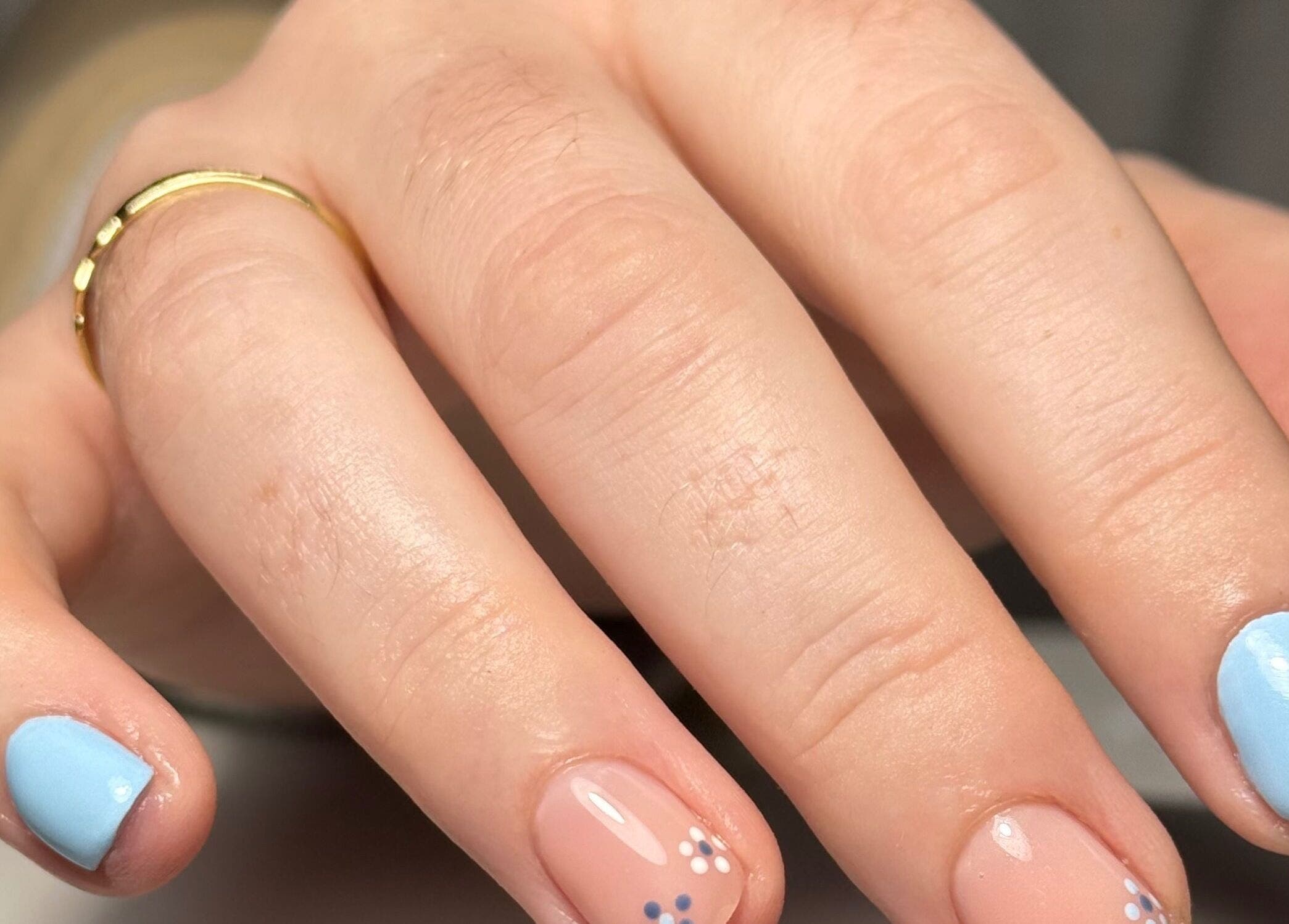 Stylish blue and nude nails with floral detail at Beauty Nook by Madie, Brabham, Western Australia, AU.