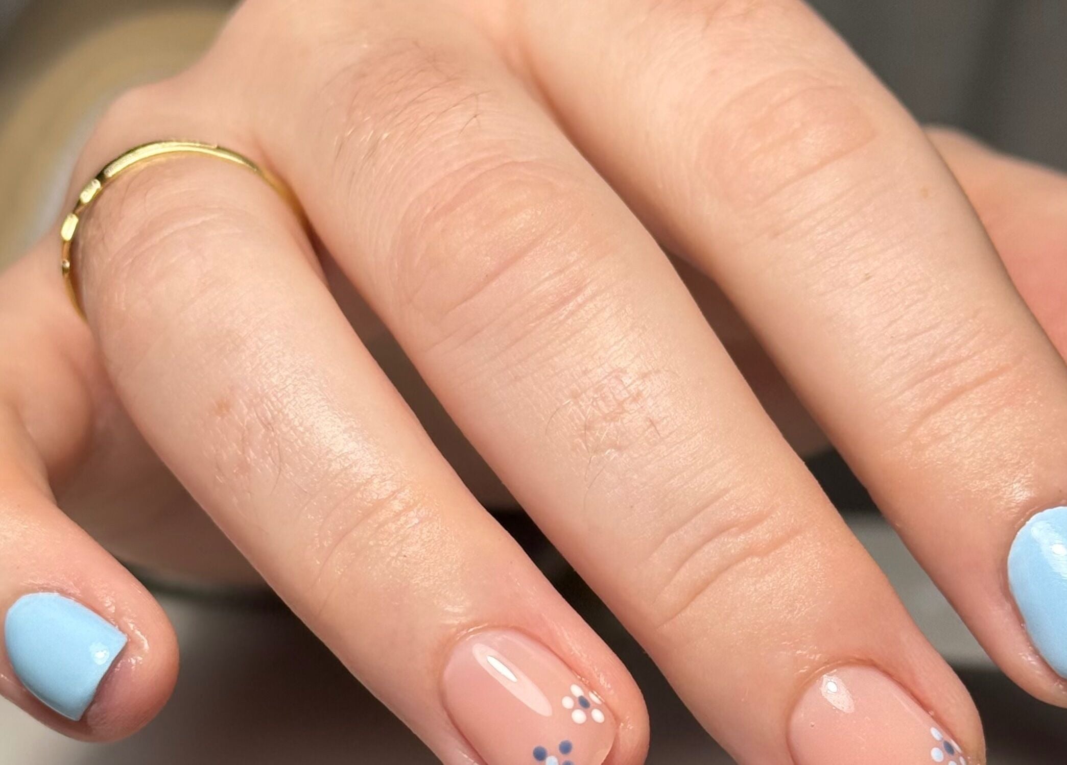 Stylish blue and nude nails with floral detail at Beauty Nook by Madie, Brabham, Western Australia, AU.