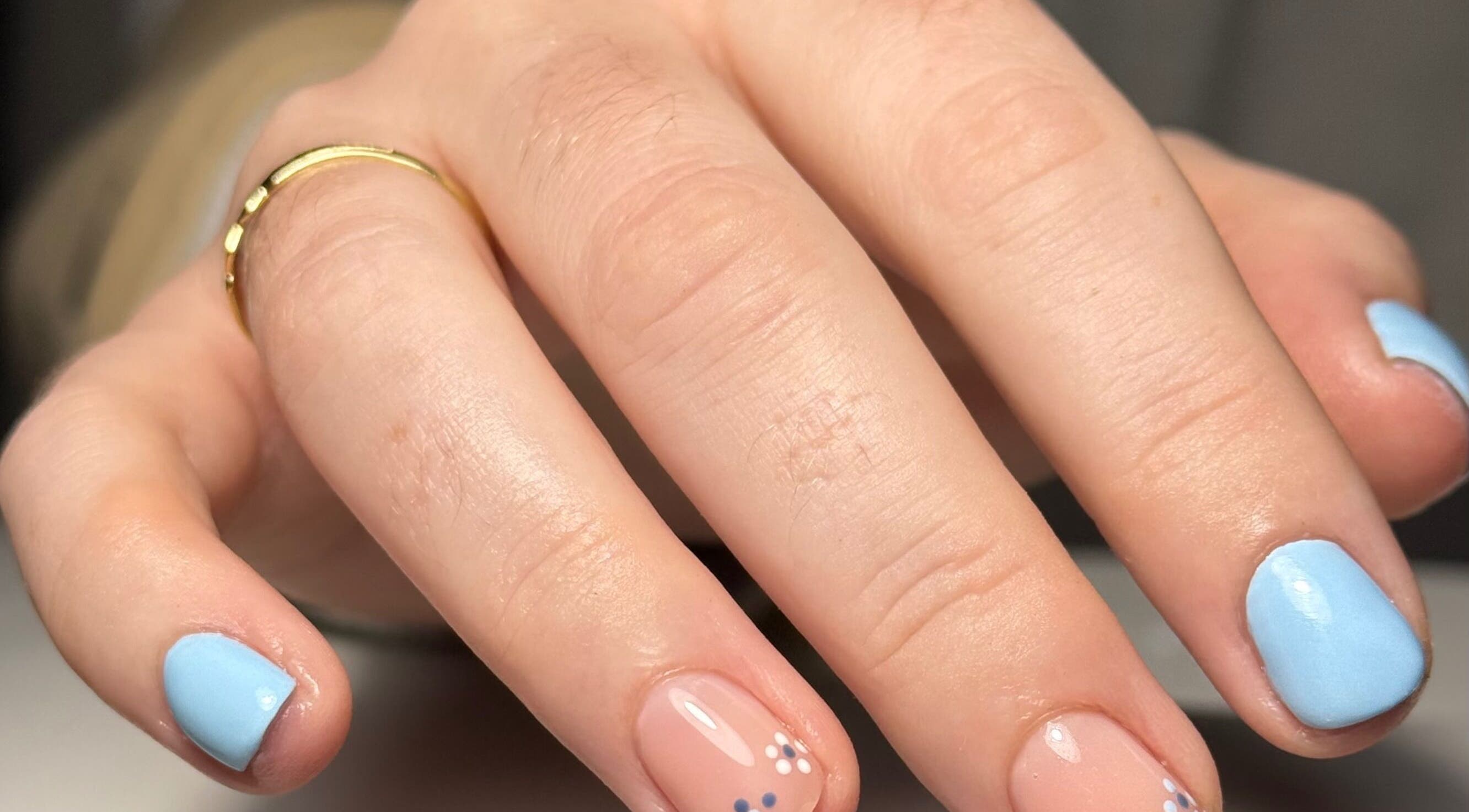 Stylish blue and nude nails with floral detail at Beauty Nook by Madie, Brabham, Western Australia, AU.