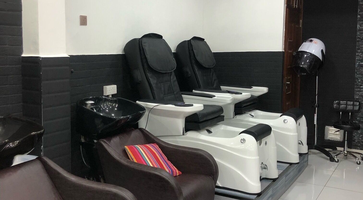 Luxurious pedicure chairs at Artistic Grooming Parlour, Nairobi, Nairobi County, KE with modern design.