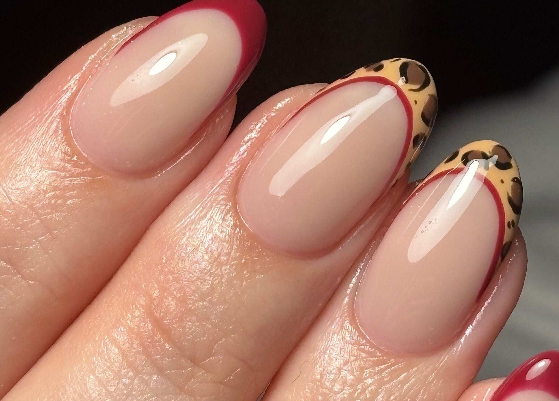 Stylish nail art with leopard print tips at Rogue Beauty, Hartlepool, England, GB.