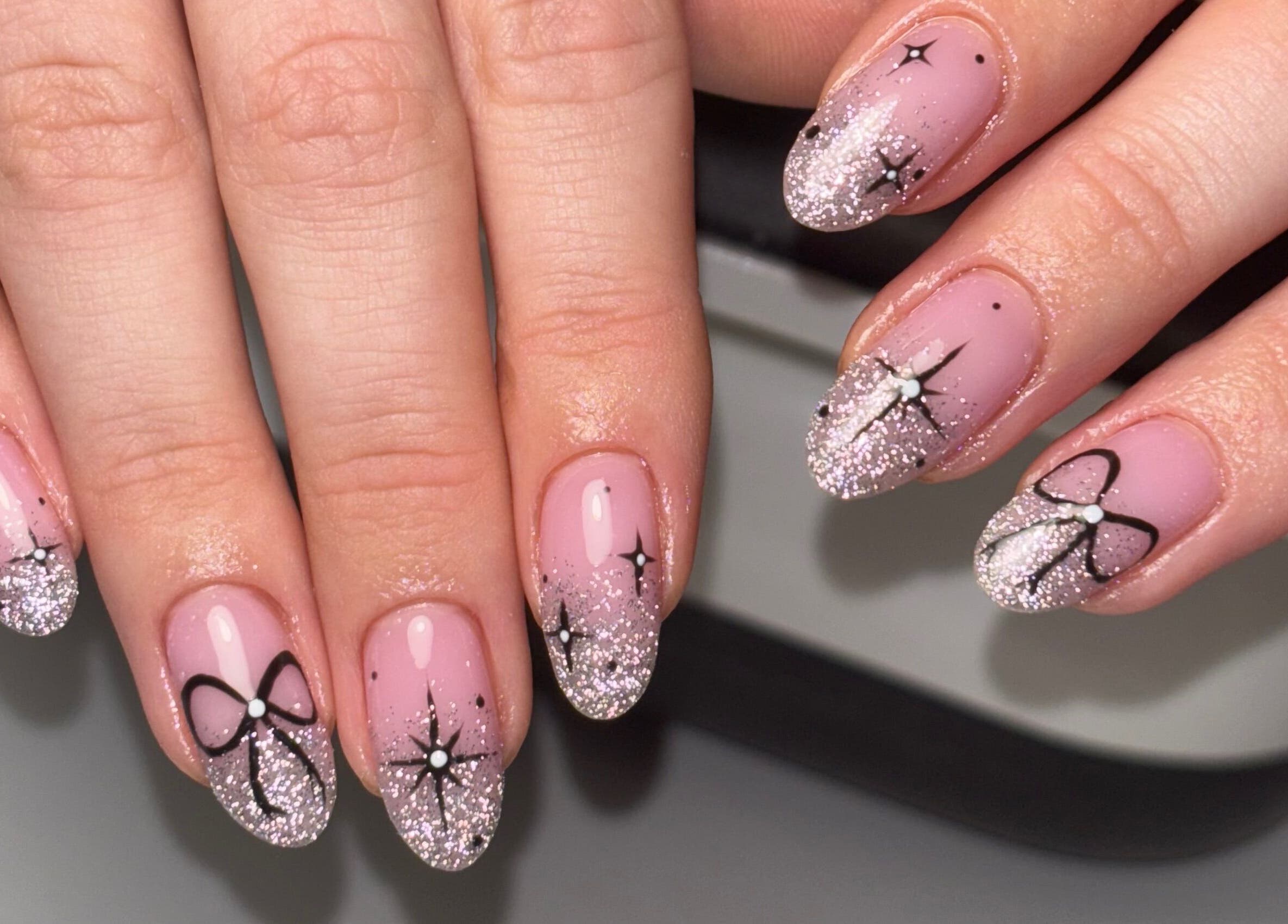 Elegant glitter bow nail art at Rogue Beauty, Hartlepool, England, GB.