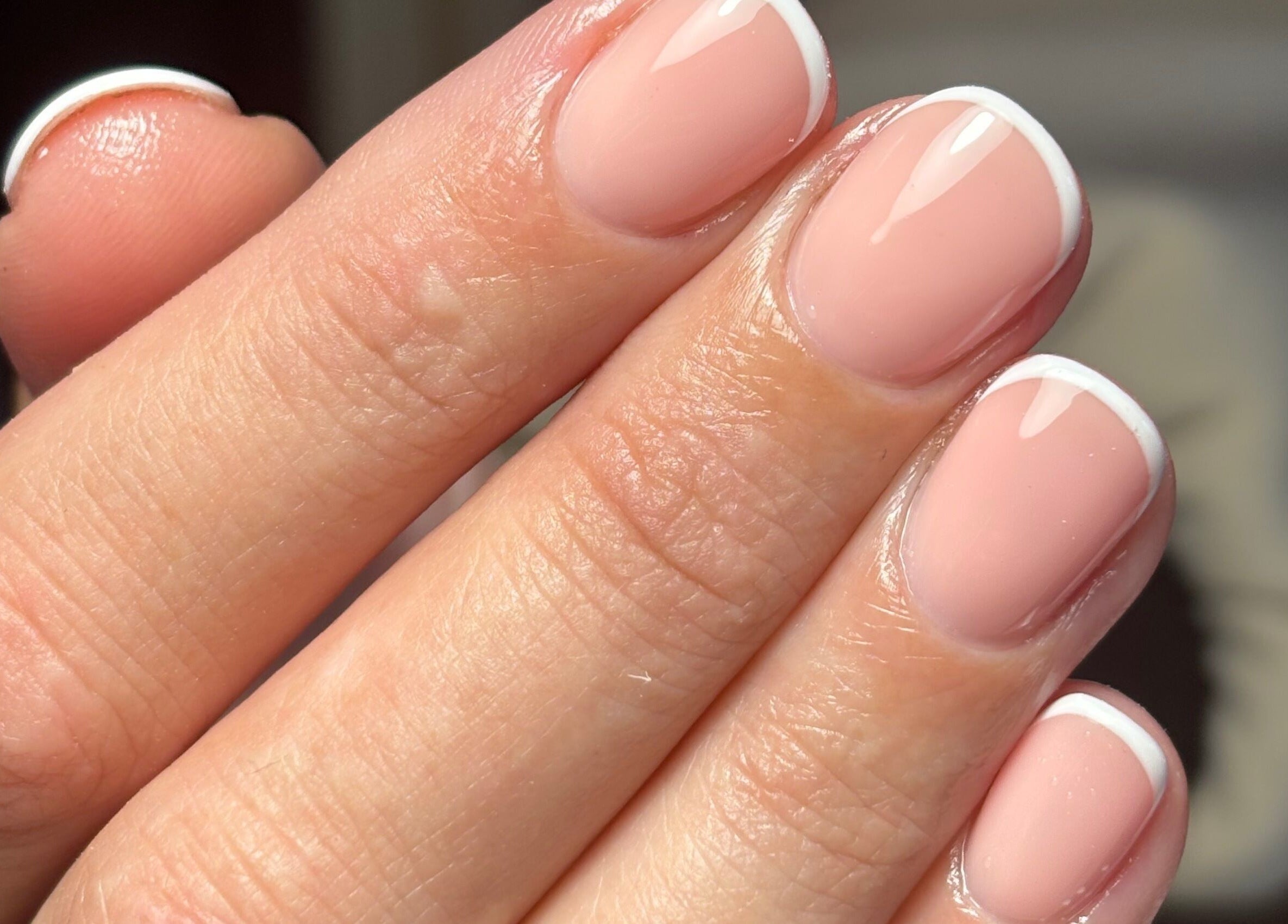 Close-up of elegant French manicure at Rogue Beauty, Hartlepool, England, GB, showcasing delicate nail artistry.