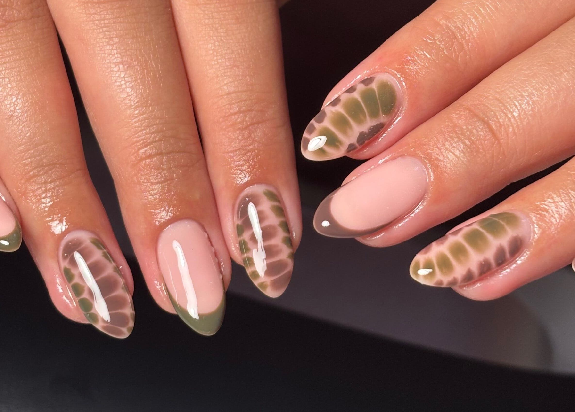 Stylish nail design at Rogue Beauty, Hartlepool, England, GB, showcasing trendy earth-toned patterns.