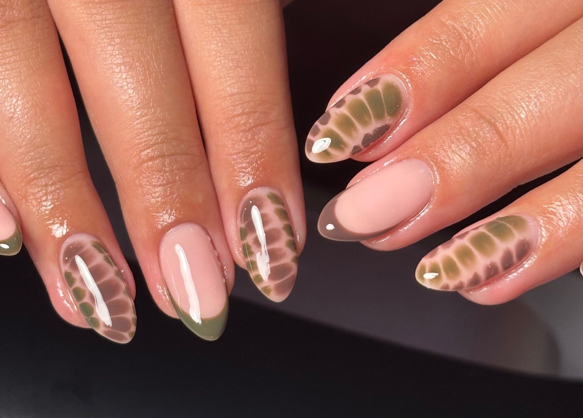 Stylish nail design at Rogue Beauty, Hartlepool, England, GB, showcasing trendy earth-toned patterns.