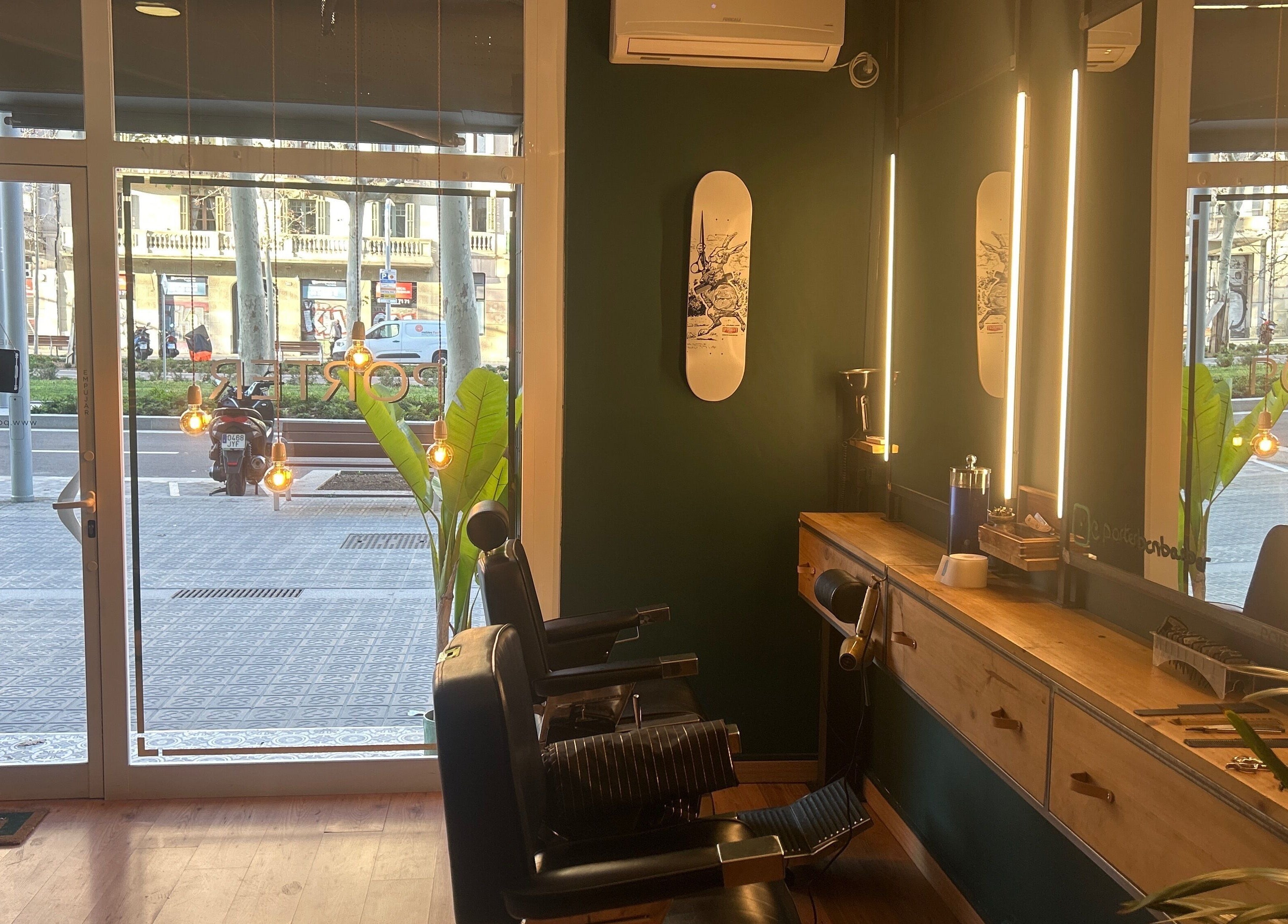 Inside view of Porter BCN Barbershop, Barcelona, Catalunya, ES showcasing stylish barber chairs and decor.