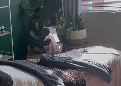 Tranquil spa room at Lavish Skincare, Somerset West, Western Cape, ZA with plants and essential oils.