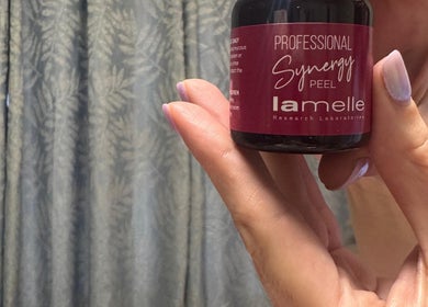 Close-up of Synergy Peel held by hand at Lavish Skincare, Somerset West, Western Cape, ZA.