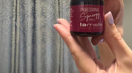 Close-up of Synergy Peel held by hand at Lavish Skincare, Somerset West, Western Cape, ZA.