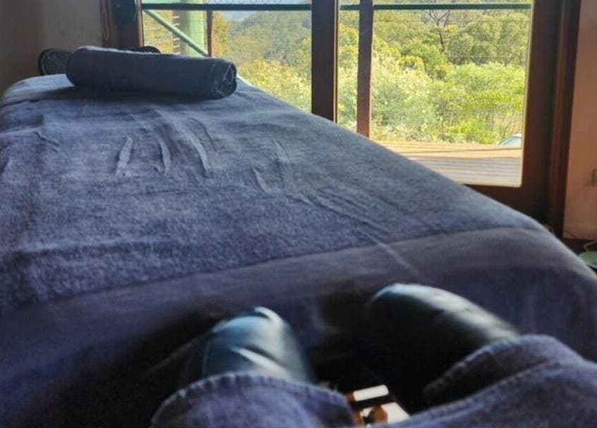 Relaxing massage table with a scenic view at French Touch Custom Massage Midtown Manhattan and Brooklyn Heights, New York, US.