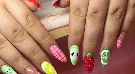 Vibrant fruit-themed nail art at Nails by Ariana in Jersey, JE. Citrus and berry designs displayed creatively.