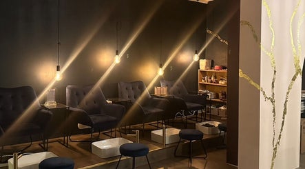 Luxurious seating area at Nails and Cocktails by Rachel, Whitchurch, England, GB with elegant lighting.