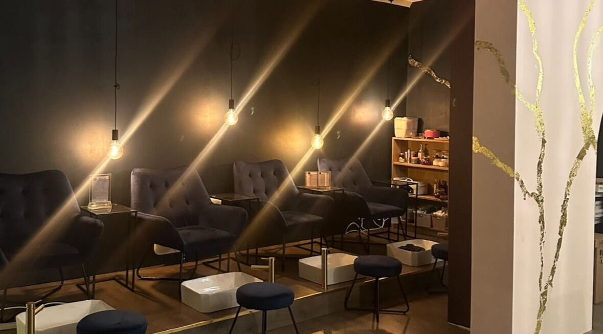 Luxurious seating area at Nails and Cocktails by Rachel, Whitchurch, England, GB with elegant lighting.