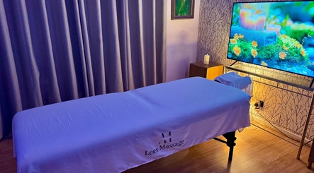 Relaxing treatment room at Lee's Massage, Portsmouth, England, GB with candles and soothing decor.