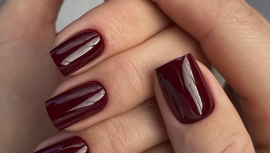 Elegant burgundy manicure at N.SPA Mobile Beauty, London, England, GB. Perfectly polished for a stylish look.