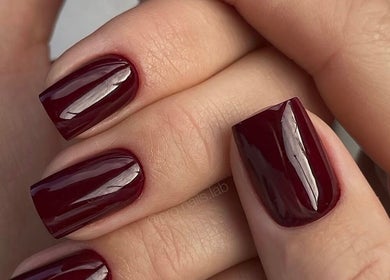 Elegant burgundy manicure at N.SPA Mobile Beauty, London, England, GB. Perfectly polished for a stylish look.