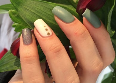 Elegant manicure at N.SPA Mobile Beauty, London, England, GB featuring unique nail designs and lush greenery.