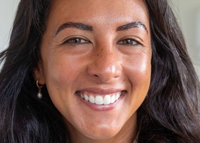 Smiling woman showcases beauty at Schofield Beauty Co, Freshwater, New South Wales, AU.