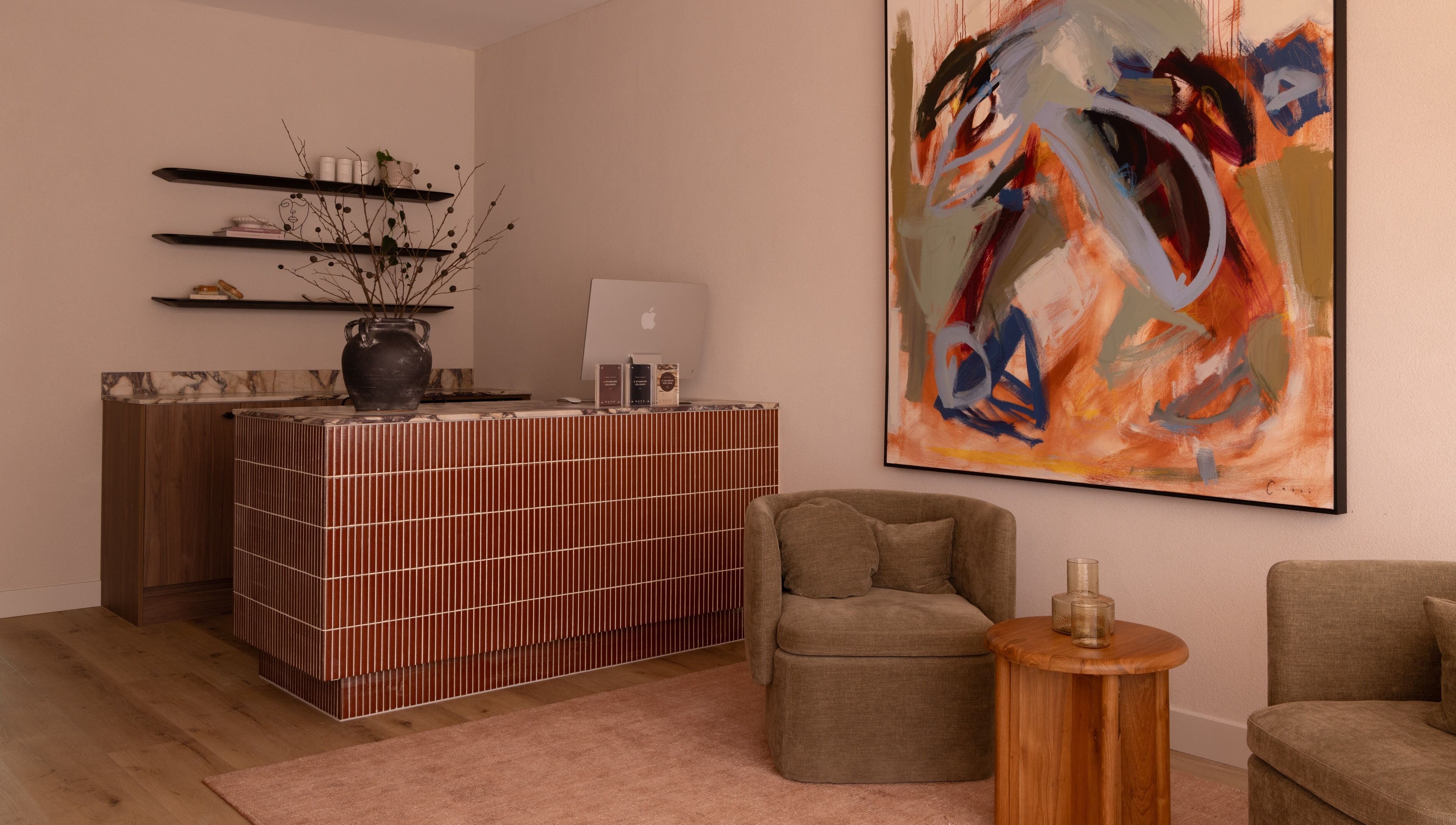 Stylish reception area at Kuyu Colonics in Turner, Australian Capital Territory, AU with abstract art and modern decor.