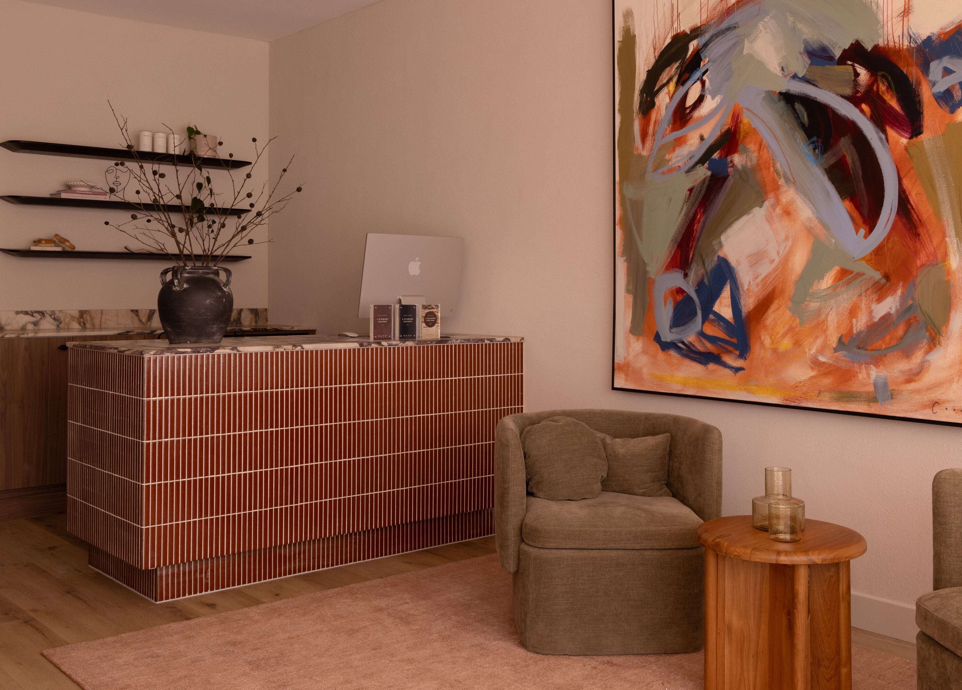 Stylish reception area at Kuyu Colonics in Turner, Australian Capital Territory, AU with abstract art and modern decor.