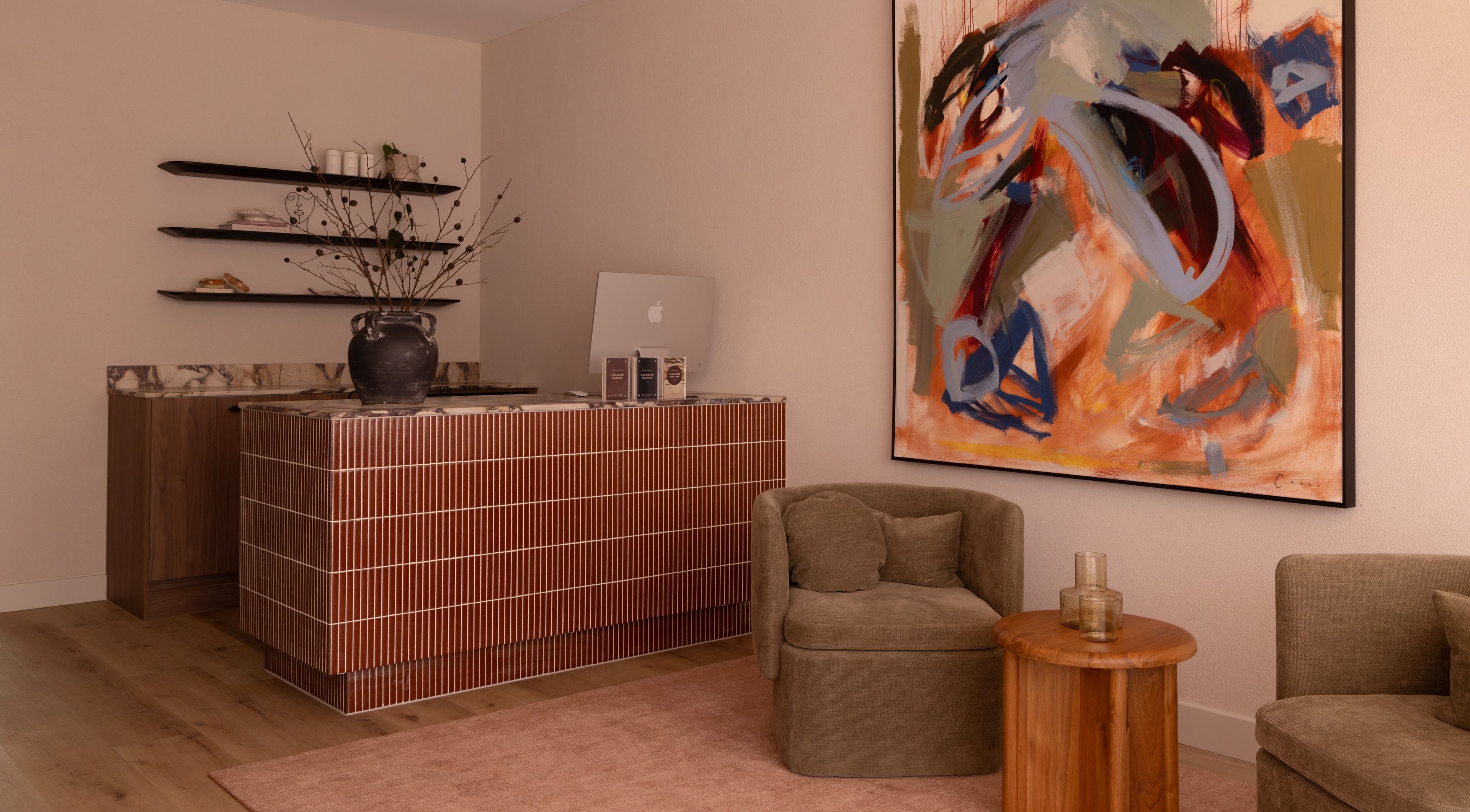 Stylish reception area at Kuyu Colonics in Turner, Australian Capital Territory, AU with abstract art and modern decor.