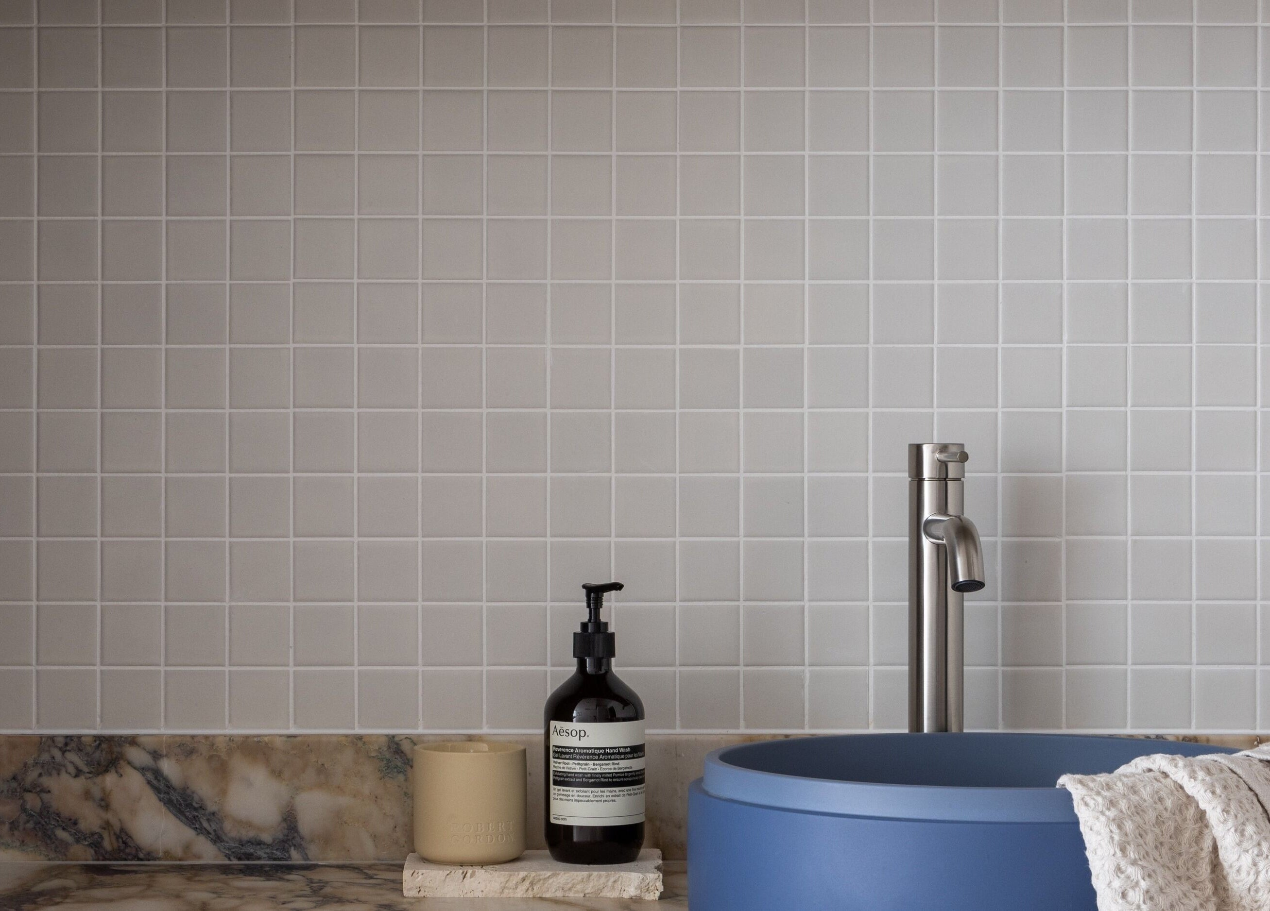 Elegant sink area at Kuyu Colonics in Turner, Australian Capital Territory, AU, featuring marble and modern fixtures.