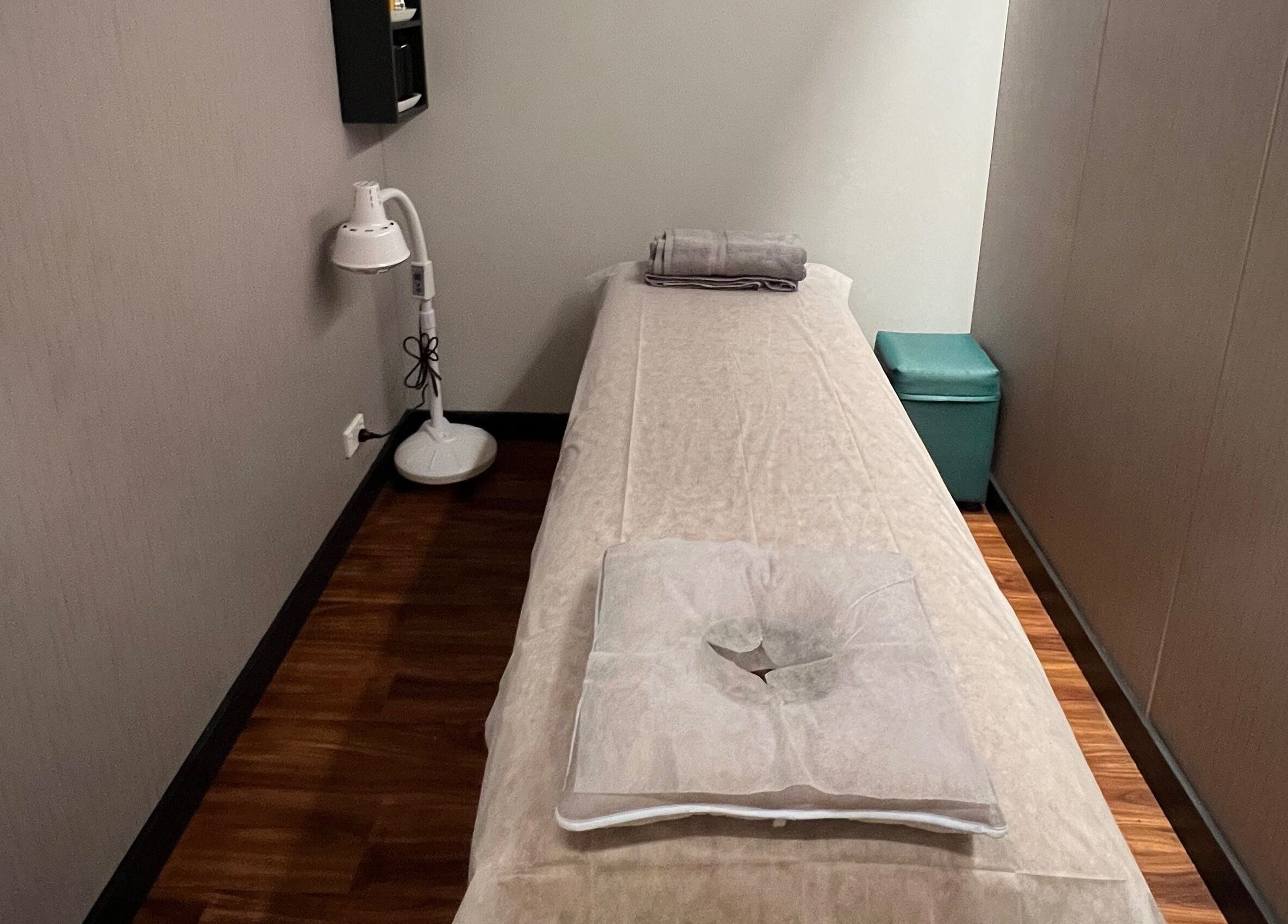 Quiet massage room at Max Massage and Acupuncture in Cardiff, New South Wales, AU with a cozy treatment bed.
