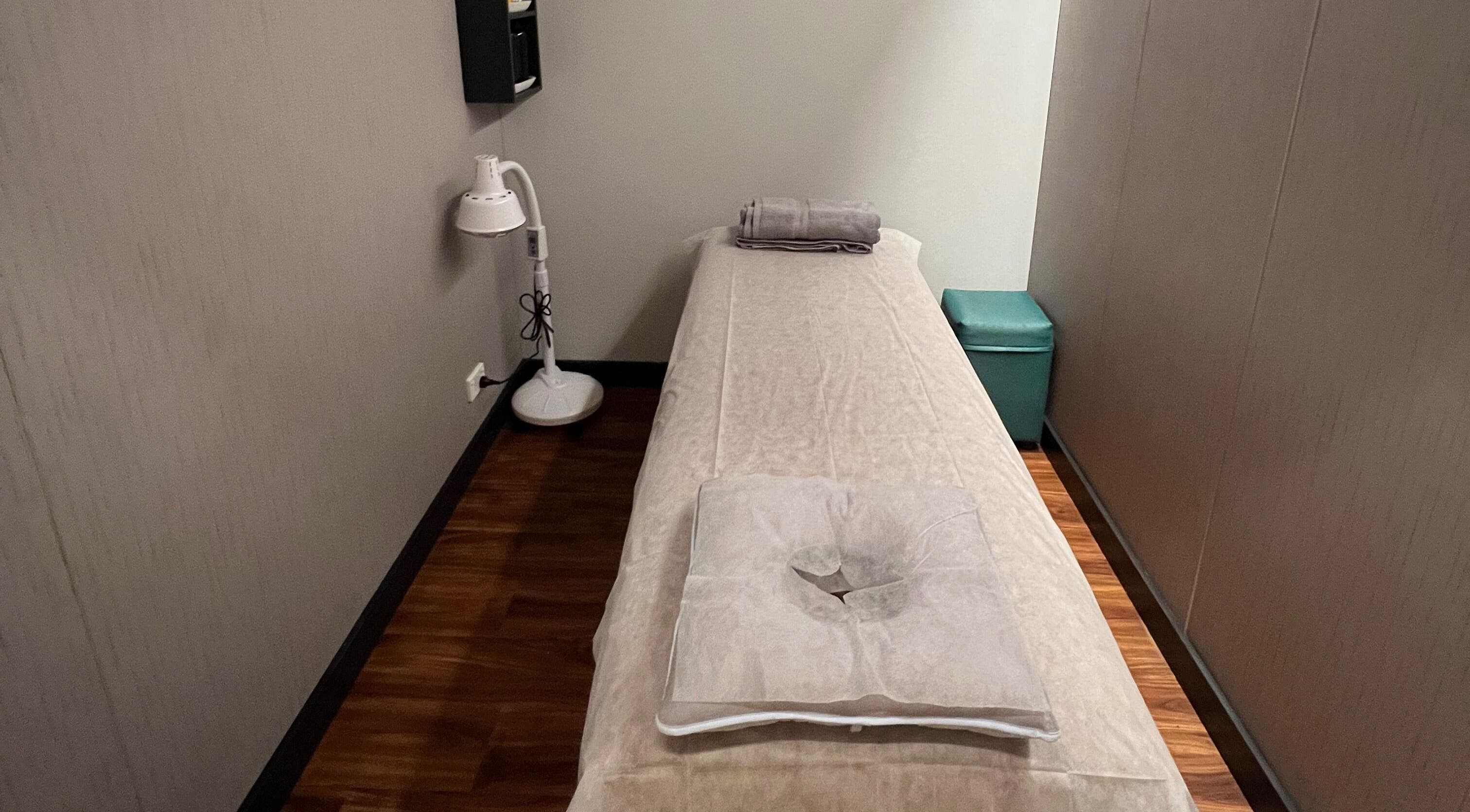Quiet massage room at Max Massage and Acupuncture in Cardiff, New South Wales, AU with a cozy treatment bed.