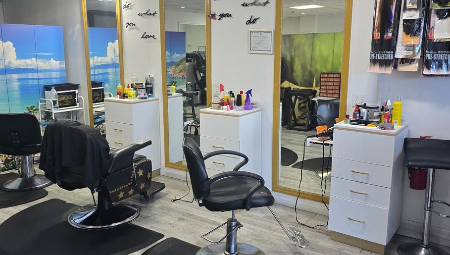 Interior of Sherifa Nails in George Town, George Town, KY. Bright mirrors, styling chairs, and a serene ambiance.