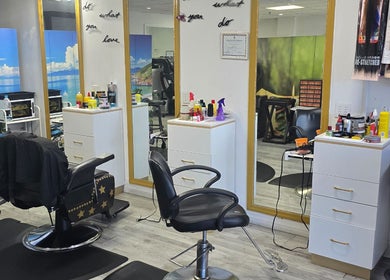 Interior of Sherifa Nails in George Town, George Town, KY. Bright mirrors, styling chairs, and a serene ambiance.