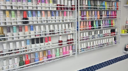 Diverse nail polish collection at Sherifa Nails, George Town, KY showcasing vibrant color options.